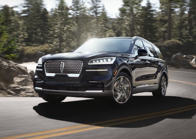 A Lincoln Aviator® SUV is being driven on a winding mountain road | Biondi Lincoln in Monroeville PA