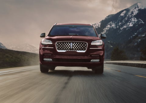 A 2024 Lincoln Aviator® SUV is shown in the Diamond Red exterior color. | Biondi Lincoln in Monroeville PA