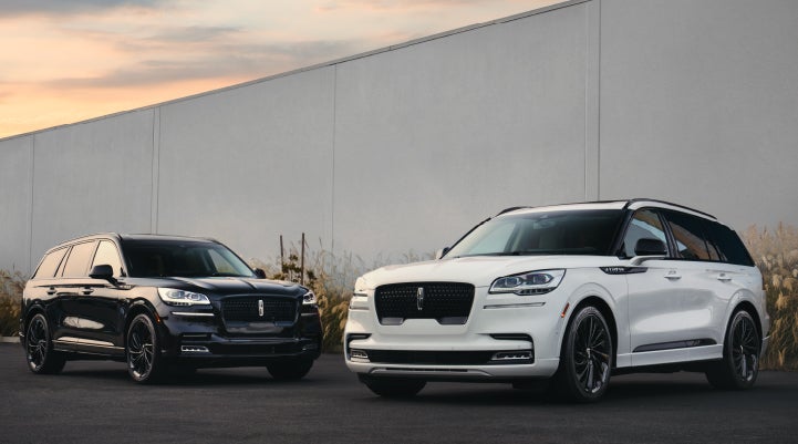 Two Lincoln Aviator® SUVs are shown with the available Jet Appearance Package | Biondi Lincoln in Monroeville PA