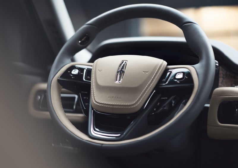 The intuitively placed controls of the steering wheel on a 2024 Lincoln Aviator® SUV | Biondi Lincoln in Monroeville PA
