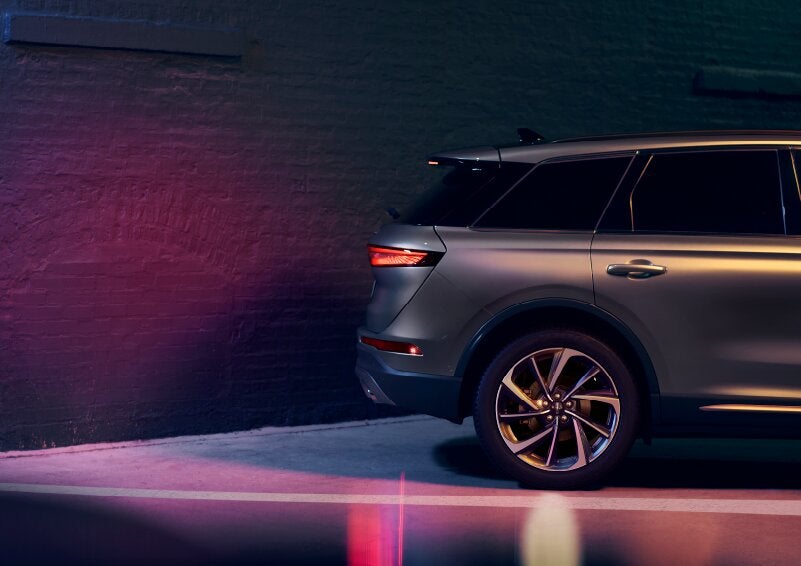 A dramatization of a 2025 Lincoln Corsair® SUV is shown backing up toward a wall. | Biondi Lincoln in Monroeville PA