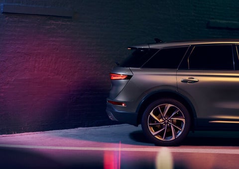 A dramatization of a 2025 Lincoln Corsair® SUV is shown backing up toward a wall. | Biondi Lincoln in Monroeville PA