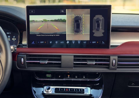 The driver of a 2024 Lincoln Corsair® SUV is shown selecting the drive mode. | Biondi Lincoln in Monroeville PA