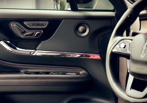 The driver of a 2024 Lincoln Corsair® SUV is shown selecting the drive mode. | Biondi Lincoln in Monroeville PA