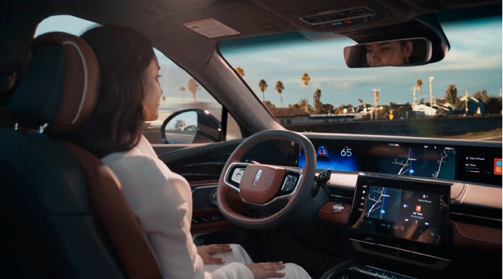 A person is shown driving hands-free on the highway with available Lincoln BlueCruise technology. | Biondi Lincoln in Monroeville PA