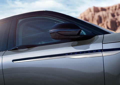 Blue lettering on the side of the vehicle that reads nautilus indicates the available hybrid powertrain. | Biondi Lincoln in Monroeville PA