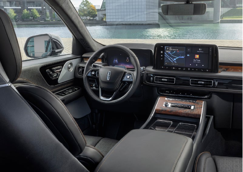 The interior of the 2026 Lincoln Aviator® SUV is shown parked with a view of a harbor through the windshield. | Biondi Lincoln in Monroeville PA