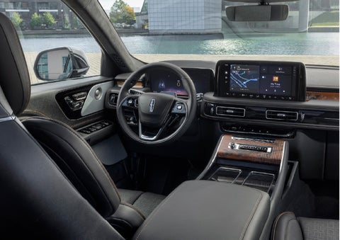 The interior of the 2026 Lincoln Aviator® SUV is shown parked with a view of a harbor through the windshield. | Biondi Lincoln in Monroeville PA