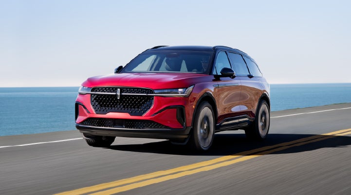 A 2026 Lincoln Nautilus® SUV is being driven on a seaside roadway. | Biondi Lincoln in Monroeville PA