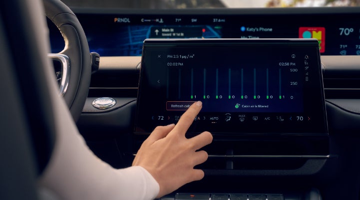A woman is shown using the Auto Air Refresh feature in the 2026 Lincoln Nautilus® SUV. | Biondi Lincoln in Monroeville PA