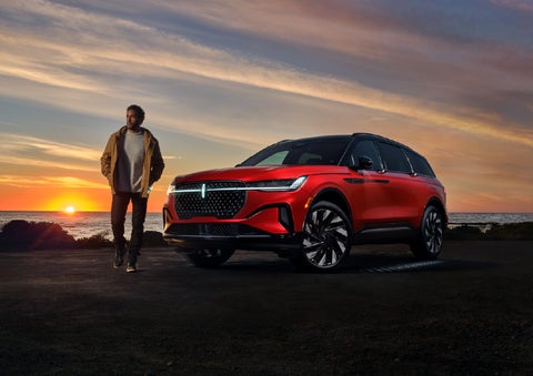 A person is shown next to a 2026 Lincoln Nautilus® SUV as the Lincoln Embrace sequence takes place. | Biondi Lincoln in Monroeville PA