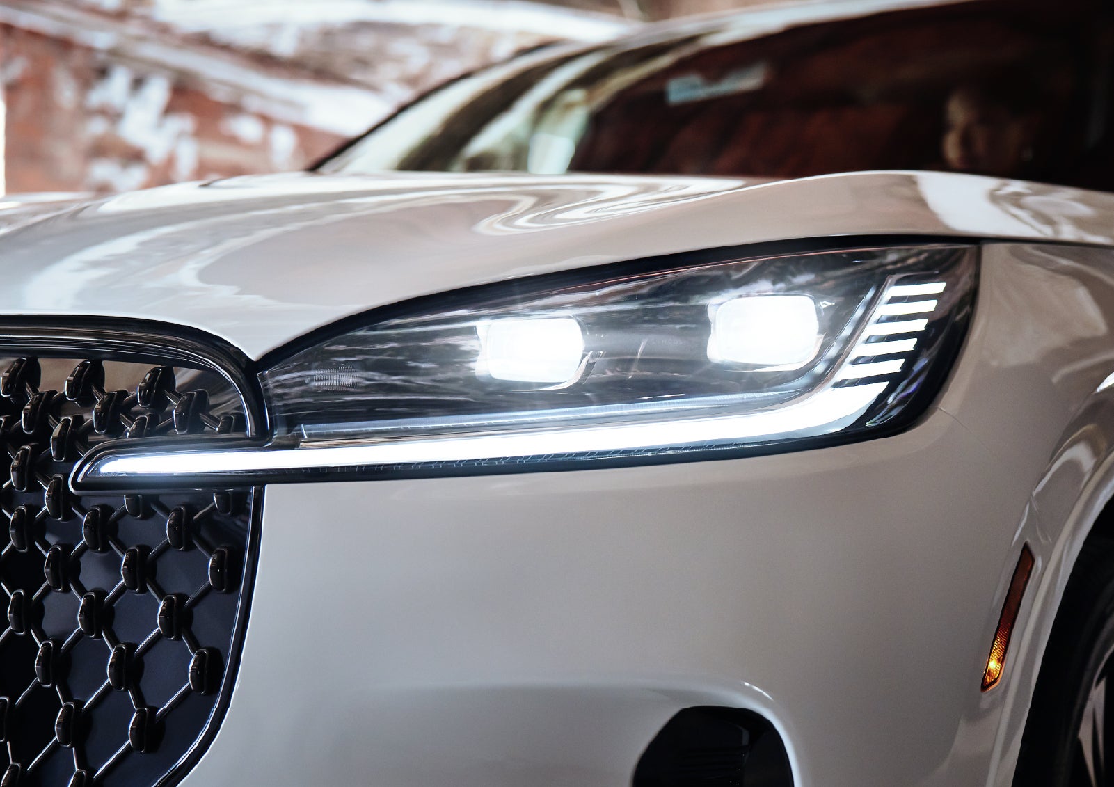 A close-up of a headlamp on the 2027 Lincoln Aviator® SUV is shown. | Biondi Lincoln in Monroeville PA