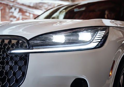 A close-up of a headlamp on the 2027 Lincoln Aviator® SUV is shown. | Biondi Lincoln in Monroeville PA