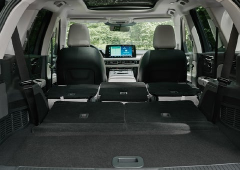 A rear to front view of the interior of a 2027 Lincoln Aviator® Black Label™ SUV shows the third and second rows folded flat | Biondi Lincoln in Monroeville PA